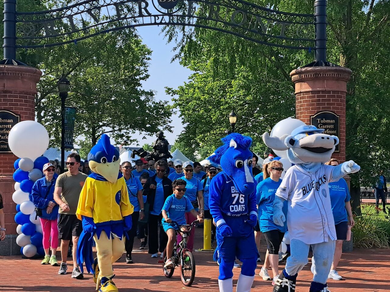 A picture of walkers at a 5K event at the Riverfront.